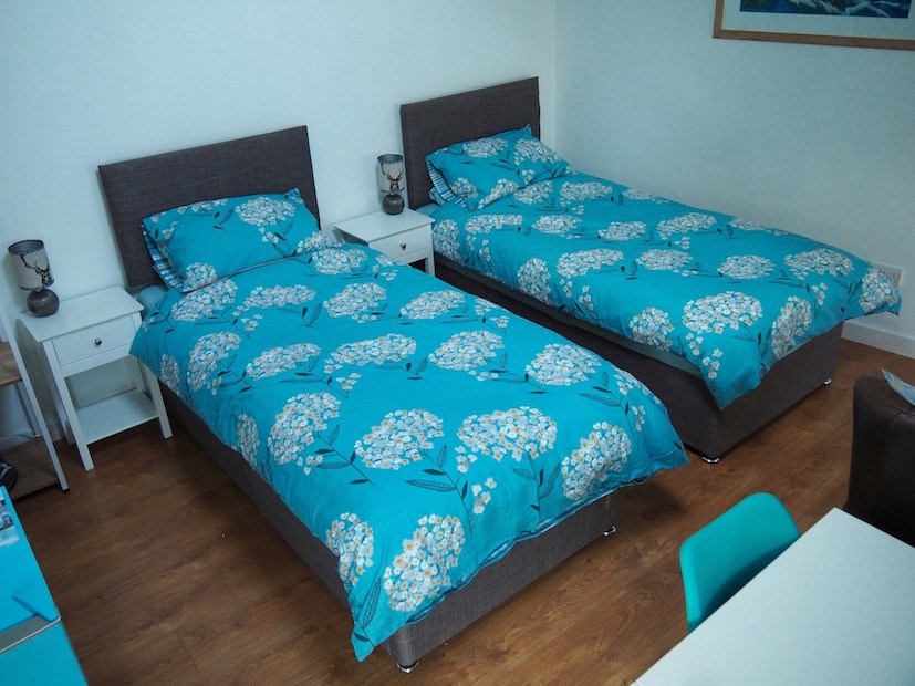 Beds with floral covers.